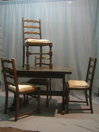 An Ercol dining suite comprising oak drawleaf dining table and 4 ladder back dining chairs