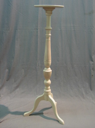 A 1920's pink painted mahogany torchere raised on cabriole supports