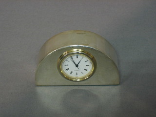 A quartz desk top clock contained in a modern arch shaped silver frame 3"