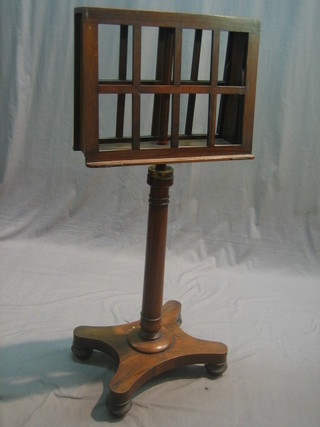 A William IV adjustable rosewood duet stand raised on a triform base