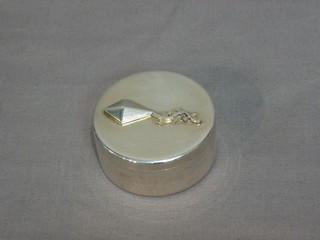 A modern silver cylindrical box cover, the lid decorated a kite, 2 ozs