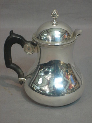 A French silver jug with armorial decoration and ebony handle, 7 ozs