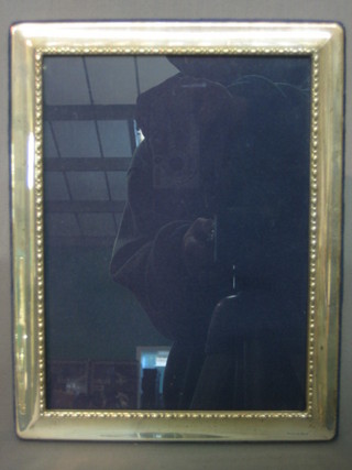 A modern silver easel photograph frame 10" x 7"