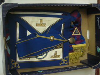 A quantity of Masonic regalia comprising a London Grand Rank Officer's apron, collar and silver gilt collar jewel and a London Grand Chapter Rank apron, collar and sash