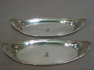A pair of oval Sheffield plate snuffer trays with armorial decoration 10"