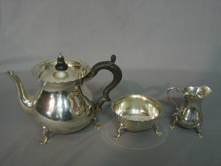 An Edwardian silver Bachelor's tea service comprising teapot, sugar bowl and milk jug, Chester 1908, 1913 and 1914 14 ozs