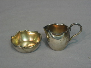A Continental silver miniature cream jug and sugar bowl 2 ozs