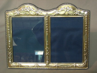 A modern silver double photograph frame 8 1/2" x 7"