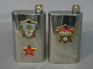 2 Russian polished steel and enamel hip flasks decorated a tank and parachutes, marked 1940-1945