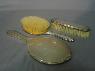 A 3 piece silver backed dressing table set, Birmingham 1962