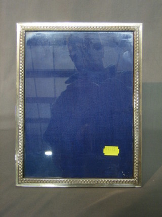 A modern silver easel photograph frame 10" x 8"