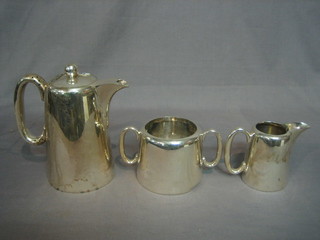 A silver plated hotwater jug, twin handled sugar bowl and cream jug
