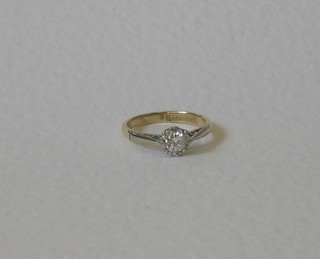 A lady's 18ct gold dress/engagement ring set a solitaire diamond