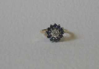 A lady's 18ct gold sapphire and diamond cluster ring