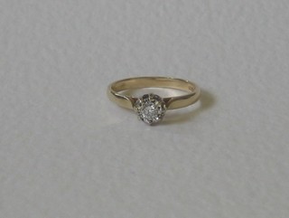 A 9ct gold dress/engagement ring set a solitaire diamond