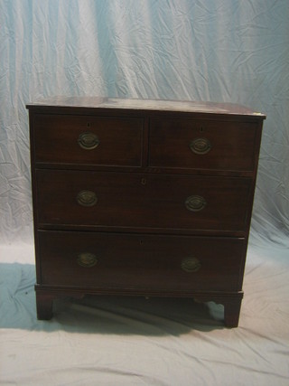 A 19th Century mahogany chest of 2 short and 2 long drawers, raised on bracket feet 36"