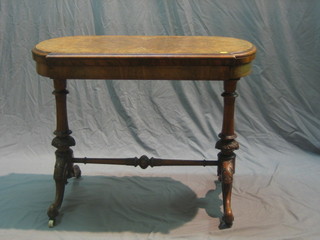 A Victorian oval inlaid figured walnut card table, raised on carved supports with H framed stretcher 36"