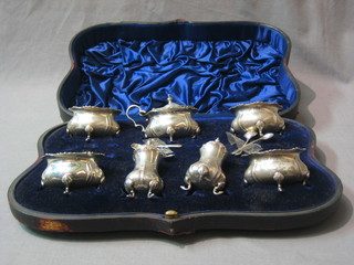 An Edwardian 7 piece condiment set comprising 4 salts, 2 peppers and a mustard pot London 1904, 10 ozs