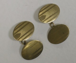 A pair of oval 9ct gold cufflinks