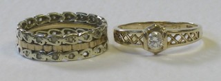A pierced gold wedding band and a gold dress ring set a diamond approx 0.23ct 