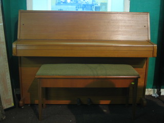 A 20th Century iron framed upright piano forte by J & J Hopkins, contained in a teak case complete with matching stool