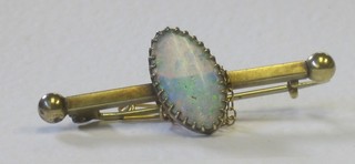A 15ct gold bar brooch set an opal