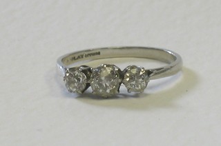 A lady's platinum engagement/dress ring set 3 diamonds