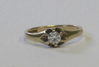 A 9ct yellow gold gypsy ring set a diamond