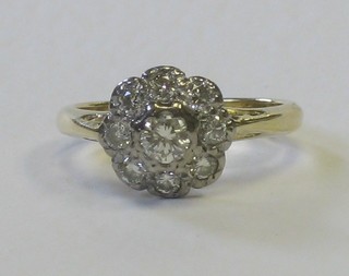 An 18ct yellow gold cluster ring set diamonds