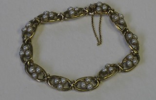 A lady's 18ct yellow gold bracelet set pearls