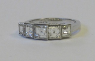 A lady's 18ct white gold dress ring set 5 square cut diamonds approx 1.90ct