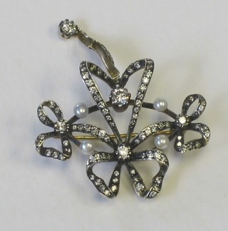 A  Victorian ribbon style brooch set diamonds and pearls, approx 2.25ct