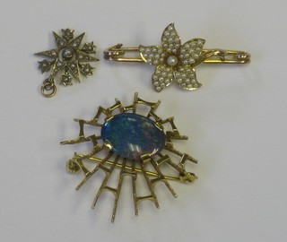 A gold floral shaped bar brooch set demi-pearls together with a matching pendant and a 9ct gold brooch in the form of a spiders web