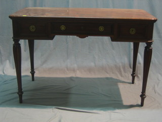 A 19th/20th Century French mahogany writing table fitted 1 long drawer flanked by 2 short drawers, raised on turned and fluted supports 43"