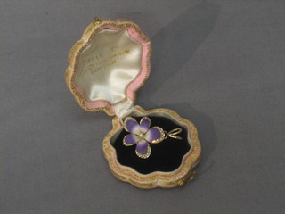 A 14ct gold and enamel brooch/pendant in the form a flower head set demi-pearls contained in a Liberty & Co scallop shaped box