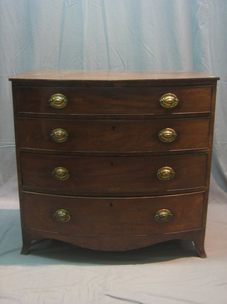 A Georgian mahogany bow front chest of 3 long graduated drawers with brass plate handles, raised on splayed bracket feet 37"