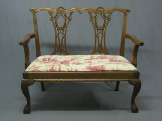 A reproduction Chippendale style double chair back settee, raised on cabriole supports 47"