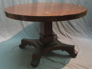 A William IV circular mahogany breakfast table, raised on a square column with triform base and scrolled feet 46"