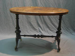 A Victorian figured walnut inlaid oval stretcher table, raised on turned supports with H framed stretcher 41"