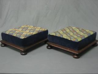 A pair of Victorian square mahogany footstools, raised on bun feet 12"