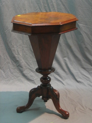 A Victorian figured walnut work table of conical form with hinged lid, raised on pillar and tripod supports 18"