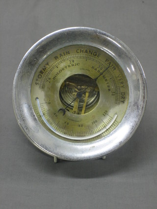 An aneroid barometer with drum case and silvered dial by Fahrenheit of Chelsea 5"