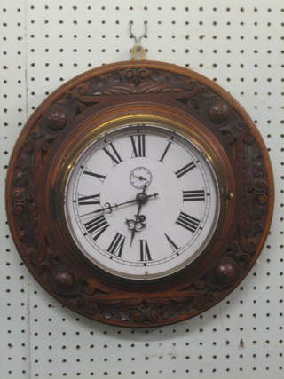 A 19th Century wall clock with 8 1/2" painted dial with Roman numerals and minute indicator, contained in a carved oak case