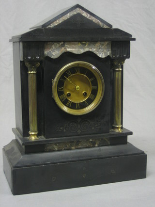 A 19th Century French 8 day mantel clock with Roman numerals contained in a black and grey marble architectural case