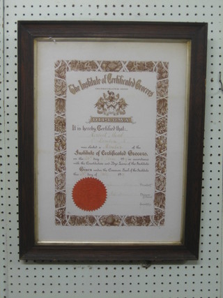 An Edwardian framed and glazed certificate "The Institute of Grocers" 18" x 13" contained in an oak frame