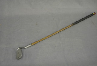 A hickory shafted Smith's model Special Niblick golf iron by Harrods