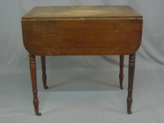 A Victorian mahogany Pembroke table fitted a frieze drawer and raised on turned supports 30"