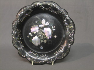 A 19th Century circular black papier mache tray with bracketed border (missing handle)