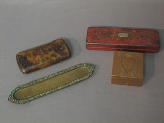 An Art Nouveau brass stamp case, the base with ostrich mark 3", an Eastern metal and enamelled pen tray 7 1/2", a leather case 7 1/2" and a pencil case