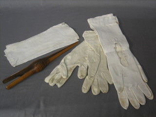 A pair of Victorian glove stretchers and 2 pairs of leather gloves